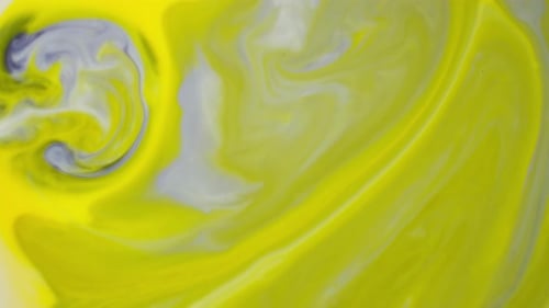 Vidéo d'arrière-plan montrant le mélange de liquides de couleurs jaune et bleu