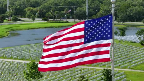 American Flag Waving Over Memorial Cemetery