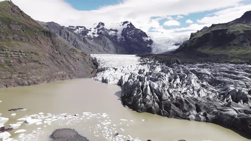 Aerial View of Iceland Glacier with Lagoon and Rugged Hills