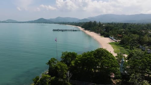 Sandy Beach with Pier and Distant Hills Ko Samui Thailand