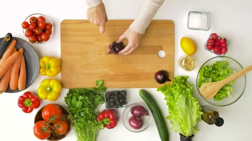 Overhead shot of woman preparing fresh salad