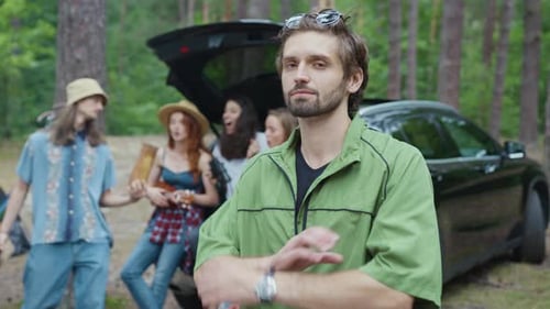 Young Adults Camping Together in the Woods