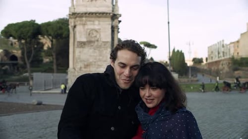 Couple Taking Selfie Near Arch in Rome Italy