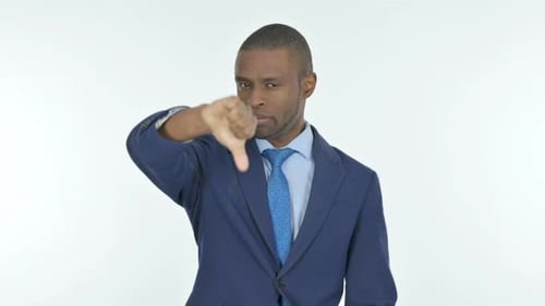 Thumbs Down by African Businessman on White Background