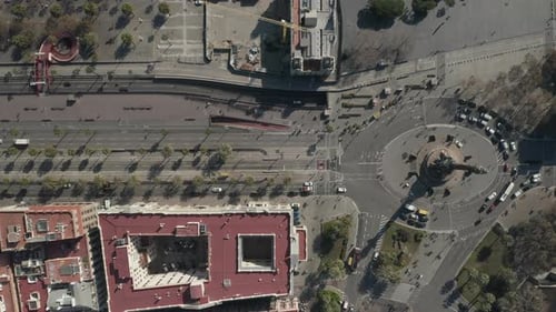 Top Down Descending Footage of Wide Multilane Boulevard Near Columbus Monument in Centre of City