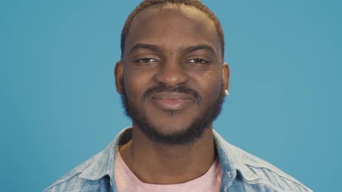 Smiling Man Portrait on Blue Background