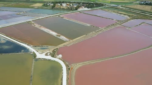 Aerial Drone View of the Salt Pans of Trapani, Sicily – Windmills and Golden Reflections