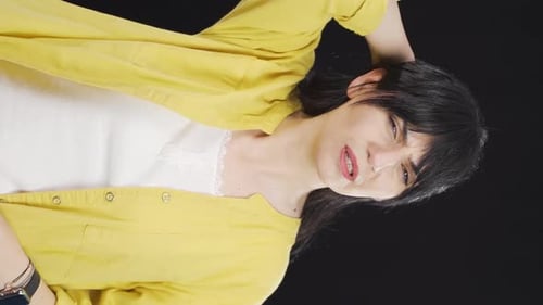 Woman Massaging Temples and Smiling