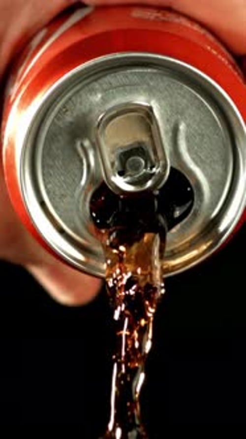 Cola Pours From a Tin Can