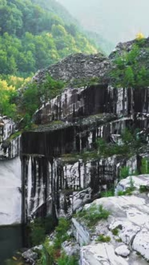 Drone Fly Down and Pan in Abandoned White Marble Quarry in Carrara Italy