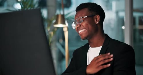Young Man Working Late at the Office