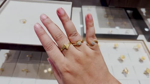 hand modeling fashionable gold ring stack combination with minimalist and floral designs