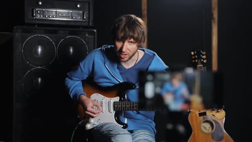 Young adult recording music