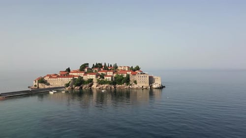 The Adriatic Sea and a beautiful aerial view of the coast and the island of Sveti Stefan.