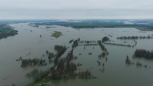 River Waal in Gelderland inundating surrounding Dutch countryside, aerial view