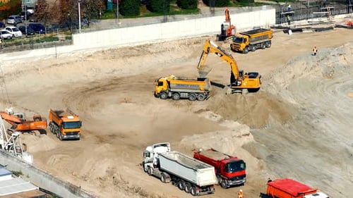 Aerial View of Construction Site with Heavy Machinery