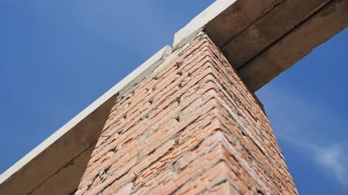 Brick Column with Concrete Plates at Construction Site