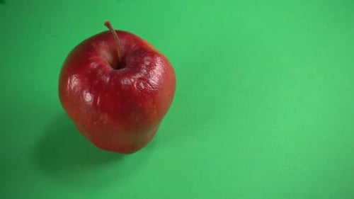 Red Apple Close Up on Green Background