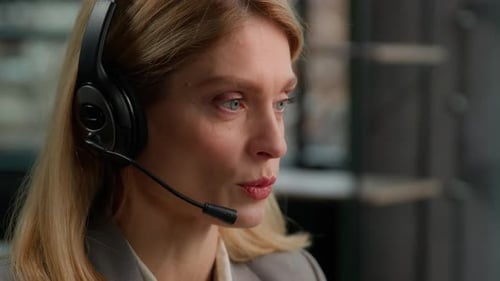 Call Center Customer Service Female Worker Middle Aged Woman in Headset Talking to Client Distant