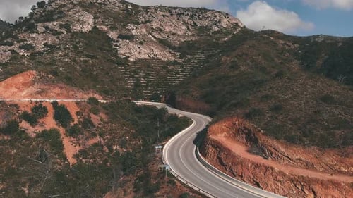 Winding narrow asphalt mountain road