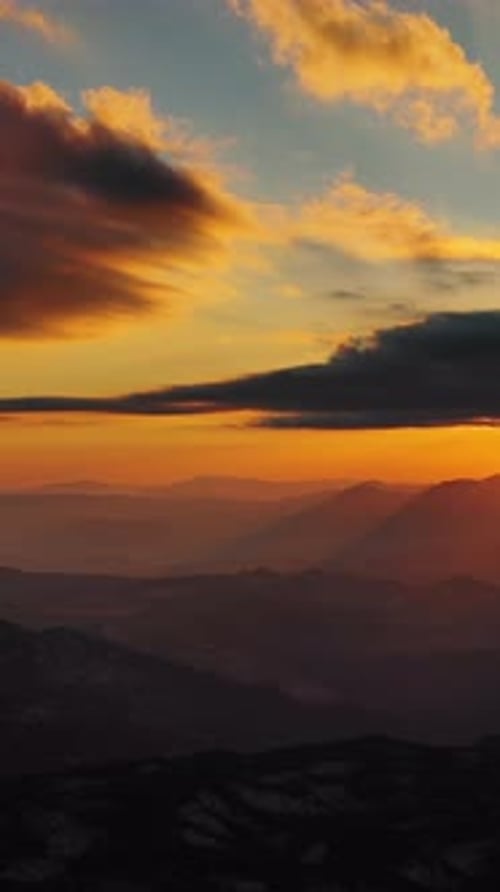 Sunset over mountain with dramatic clouds