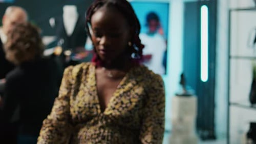 Woman Browsing Clothes in Upscale Boutique