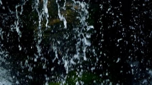 Scenic Waterfall Cascading Over Rocks