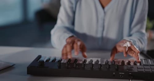 Close up of person playing electric keyboard