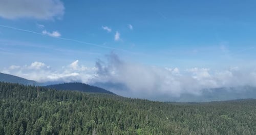 Aerial View of Green Mountain Range with Blue Sky