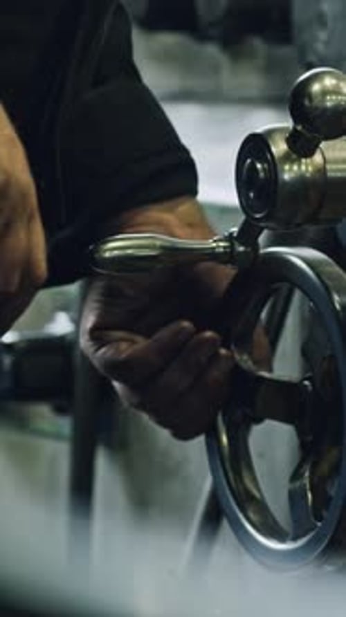 Metal lathe operation by skilled worker in industrial workshop