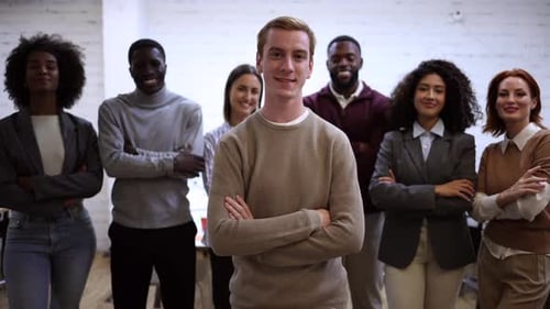 Diverse team exhibiting unity and collaboration in modern office