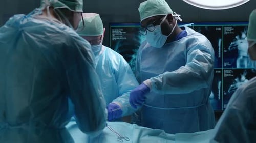 Team of Professional Medical Surgeons Performs the Surgical Operation in a Modern Hospital Doctors