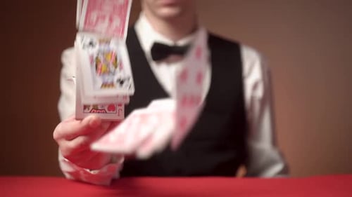Scattering playing cards on table