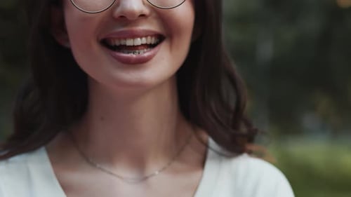 Smiling Woman Sticks Tongue Out At Camera