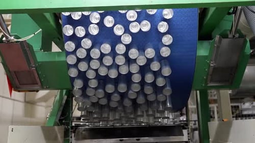Conveyor line with the production of aluminum cans. Production of aluminum cans for drinks. Plant of