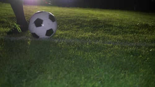 Soccer Player Athlete Training Foot Ball Sport on Soccer Field at Night