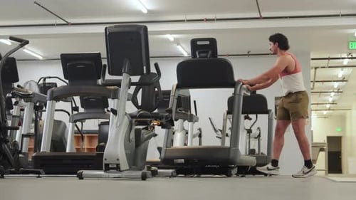 Man Warming Up In The Gym - Wide Shot