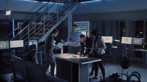 Engineers Collaborate in Modern Office with Robotics Technology