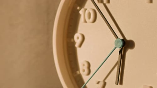 White Analog Clock on Wall with Fast Running Seconds Hand