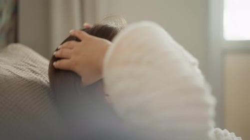 Woman Relaxing with Eye Masks in Natural Light