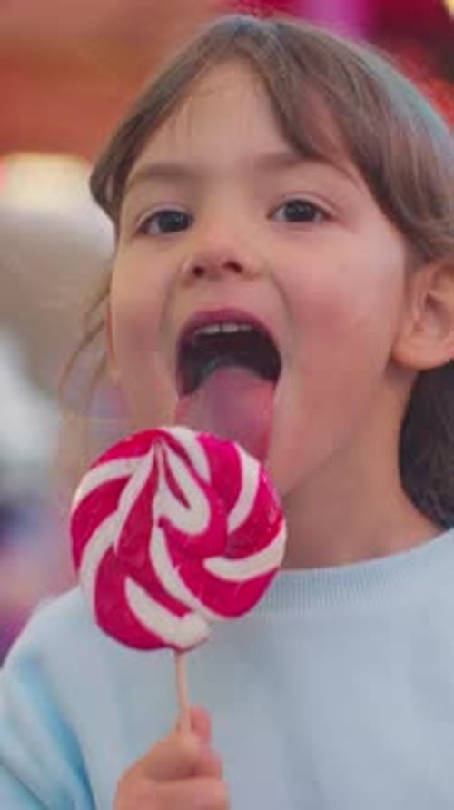 Happy Girl Eating Lollipop Close Up Portrait