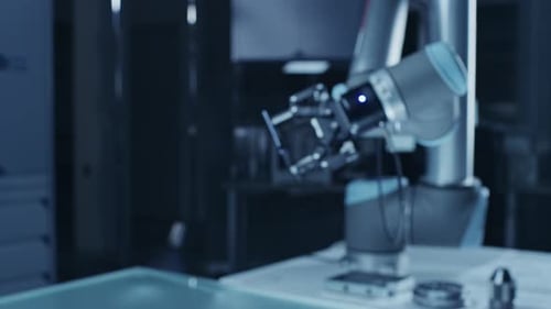 Robot Arm Holding Green Mock-up Screen Smartphone in Landscape Mode, Smoothly Moving into Focus. In