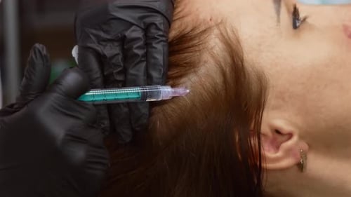 Woman Receiving Injection on Scalp at Clinic