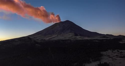 Aerial hyperlpase of the sunrise at the Popocatepetl active volcano in El Paso de Cortes. February 1