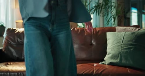 Woman Relaxing on Couch in Cozy Living Room