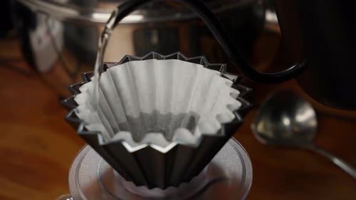 Pouring Water into Coffee Filter Close Up