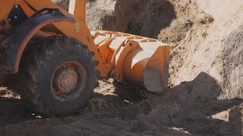 Heavy Machinery Working on Quarry with Equipment for Production
