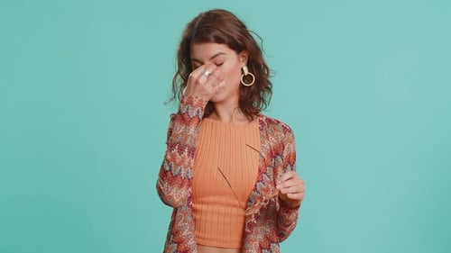 Woman Removes Glasses with Eyestrain