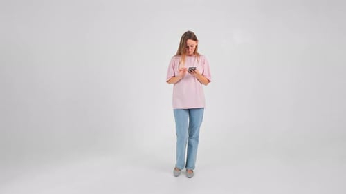 Isolated View of Caucasian Woman Texting Message on Smartphone and Walking on the Spot