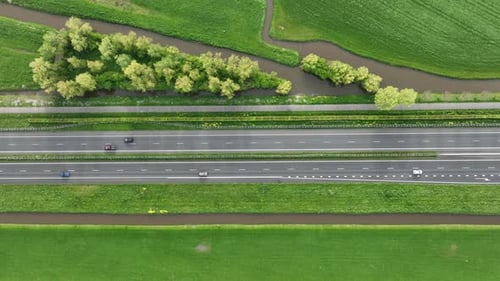 Drone view of a road in the middle of a field. Landscape from a drone. Road and transport.